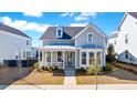 Charming two-story home with a welcoming porch and well-manicured front yard at 170 Callibluff Dr, Summerville, SC 29486