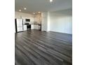 Open-concept kitchen featuring stainless steel appliances, granite countertops, and sleek modern flooring at 1703 Scarlett Maple St, Summerville, SC 29486