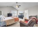 Serene main bedroom with ceiling fan, ample natural light, and ensuite bathroom access at 211 Tall Grass Ct, Summerville, SC 29483