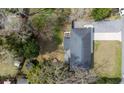 Aerial view of home with a spacious backyard, patio area, long driveway, and mature trees at 2137 Barbour Dr, Charleston, SC 29414