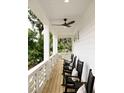 Inviting porch with rocking chairs and decorative pillows, perfect for enjoying the outdoors at 2151 Arthur Rose Ln, Johns Island, SC 29455