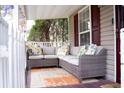 Inviting front porch with comfortable seating and a decorative rug, perfect for relaxation at 2590 Otranto Rd, North Charleston, SC 29406