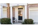 Elegant front entrance with white columns, brick accents and cozy front porch seating at 264 Fair Sailing Rd # 42, Mount Pleasant, SC 29466