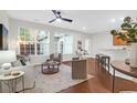 Bright living room with hardwood floors, large windows, and stylish furnishings at 3049 Park West Blvd, Mount Pleasant, SC 29466