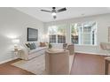 Inviting living room featuring neutral decor, abundant natural light, and ceiling fan at 3049 Park West Blvd, Mount Pleasant, SC 29466