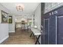 Inviting foyer with wood floors and an open view of the updated kitchen at 318 Hollywood Dr, Charleston, SC 29407