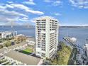 Aerial view featuring a waterfront condo building with balconies and views of the Ravenel Bridge in the distance at 330 Concord St # 7 A, Charleston, SC 29401