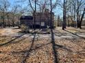 Brick house with a circular drive and mature trees and landscaping at 388 Benton Farm Rd, Walterboro, SC 29488