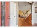 The front door opens to a living room featuring hardwood floors, stairs, and an open floor plan at 5429 Roxbury Dr, North Charleston, SC 29418