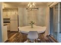 Eat-in kitchen featuring a round table, modern chandelier, and sliding glass door at 6211 Rolling Fork Rd. # 1504 Apt D, North Charleston, SC 29406