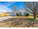 Well-kept single-story home with an attached garage and a nicely landscaped front yard at 8396 Waltham Rd, North Charleston, SC 29406