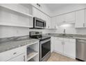 Updated kitchen featuring stainless steel appliances, granite countertops, and white cabinetry at 1042 Planters Pl, Mount Pleasant, SC 29464