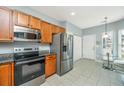 Functional kitchen with stainless steel appliances, granite countertops, eat-in dining, and bright natural light at 106 Sea Lavender Ln, Summerville, SC 29486