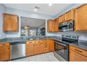 Well-equipped kitchen featuring stainless steel appliances, granite countertops, and light wood cabinetry at 106 Sea Lavender Ln, Summerville, SC 29486