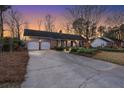 Lovely brick home with two-car garage, green door, and manicured landscaping at 110 Dunbury Dr, Summerville, SC 29485