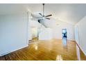 Bright open living room with hardwood floors, cathedral ceiling, staircase access, and modern light fixtures at 112 Mansfield Blvd, North Charleston, SC 29418