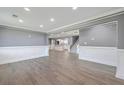 Spacious living room showcasing wood floors, detailed trim, and recessed lighting at 1186 French Santee Rd, Jamestown, SC 29453