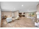Open floor plan with living room and kitchen and dining area. Natural light and neutral tones create a welcoming space at 1399 Old Whitesville Rd, Moncks Corner, SC 29461