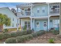 Charming coastal townhome featuring a private balcony and well-maintained landscaping at 1717 Brittlebush Ln, Johns Island, SC 29455