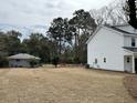 Large grassy backyard with trees, ready for outdoor activities and landscaping at 1817 Edgewood Dr, Charleston, SC 29407