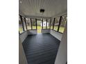 Relaxing screened-in porch featuring a painted floor and ceiling, perfect for enjoying the outdoors at 201 Hayden St St, Walterboro, SC 29488