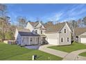 Beautiful home featuring a lush lawn, long driveway, and an attached two-car garage at 213 Cherry Grove Dr, Summerville, SC 29483