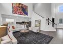 Open-concept living area with high ceilings, modern furniture, and seamless access to kitchen at 213 Cherry Grove Dr, Summerville, SC 29483