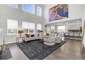 Bright living room with soaring ceilings, large windows, and stylish decor at 213 Cherry Grove Dr, Summerville, SC 29483