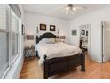 Comfortable main bedroom with a ceiling fan, wood flooring, and a large bed at 2244 Ashley Crossing Dr # 426, Charleston, SC 29414