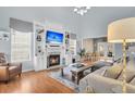 Spacious living room with fireplace, built-in shelving, and abundant natural light at 366 Clayton Dr, Charleston, SC 29414