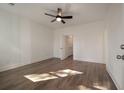 Bright bedroom with hardwood floors, ceiling fan, and white trim at 410 Katies Scenic Ct, Charleston, SC 29492