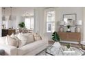 Bright and airy living room featuring modern decor, plush seating, and stylish accents at 711 Alma Square Dr, Moncks Corner, SC 29461