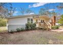Charming one-story home featuring a cozy front porch and a landscaped front yard at 847 Quail Dr, Charleston, SC 29412
