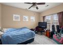 Neutral bedroom bathed in natural light from plentiful windows, with ceiling fan at 9000 Hema Ln, Summerville, SC 29483