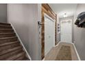 Inviting hallway with wood accent wall, showcasing the home's unique architectural details and design at 9000 Hema Ln, Summerville, SC 29483