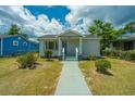 Well-manicured single story house with a sidewalk leading to the covered entrance at 111 Carver St, Walterboro, SC 29488