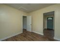 Bright living room features hard wood floors and neutral colored paint at 111 Carver St, Walterboro, SC 29488