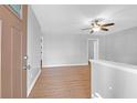 Bright and airy living room with hardwood floors, ceiling fan, and fresh neutral paint at 1117 Oceanview Rd, Charleston, SC 29412