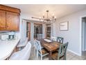 Bright dining nook featuring a distressed table, unique chairs, and a view through the bay window at 112 Ravenswood Ct, Summerville, SC 29485