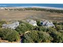 A high angle view of the property with a waterway separating the island from the mainland at 1136 Ocean Forest Ln, Seabrook Island, SC 29455