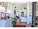 Inviting entryway with hardwood floors and views into the stylishly decorated living spaces at 1174 Hitchfield Ln, Awendaw, SC 29429