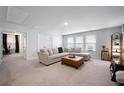 Spacious living room with neutral carpet, a plush sectional sofa, and plenty of natural light at 146 Brant Dr, Summerville, SC 29483