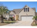 Charming single-Gathering home with a manicured lawn, attached garage, and lovely curb appeal at 1465 Water Edge Dr, Charleston, SC 29492