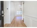 Inviting home foyer with hardwood flooring and ample natural light flowing from the living room at 1465 Water Edge Dr, Charleston, SC 29492