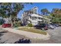 Exterior angle view showcasing the architectural details of the home and its placement within the community's landscape at 1530 Fort Johnson Rd # 3C, Charleston, SC 29412