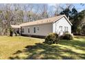 Back view of a single-story home featuring a well-kept lawn and classic design at 1816 Grimball Rd, Charleston, SC 29412