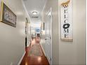 Hallway featuring hardwood floors and a view into the living area at 1818 Towne St, Johns Island, SC 29455