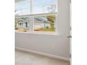 Bedroom window view of a blue home exterior, offering natural light and an airy feel at 2254 Macallan Blvd, Ravenel, SC 29470