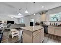 Open-concept kitchen featuring granite countertops, stainless steel appliances, island with bar stool seating and a modern design at 231 Hayworth Rd, Summerville, SC 29486