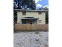 Two-story home with wood fence and a gated entrance at 2636 S Allen Dr # 2559 Accabee A & B, North Charleston, SC 29405